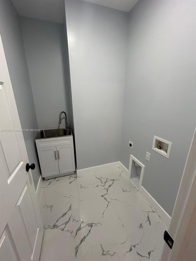 laundry room with cabinet space, electric dryer hookup, light marble finish floors, washer hookup, and baseboards