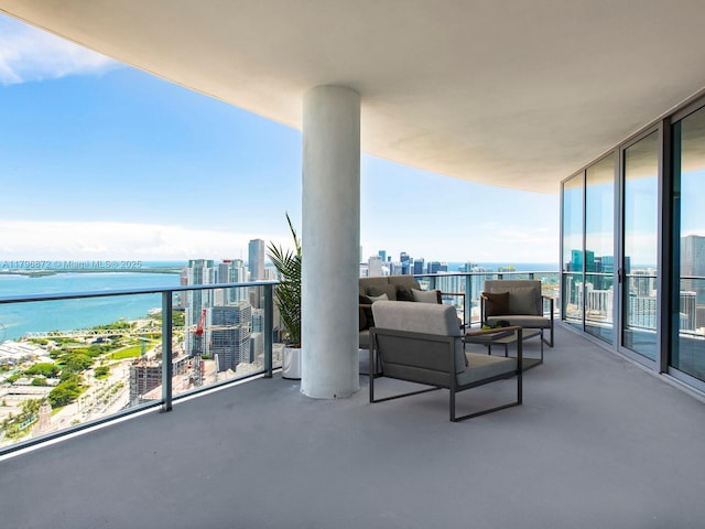 851 NE 1st Ave Unit Ph5011, Miami, FL 33132 - balcony featuring a water view, a view of city, and an outdoor living space