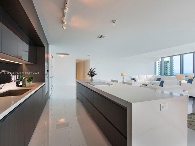 851 NE 1st Ave Unit Ph5011, Miami, FL 33132 - kitchen featuring modern cabinets, a sink, light countertops, and a kitchen island with sink