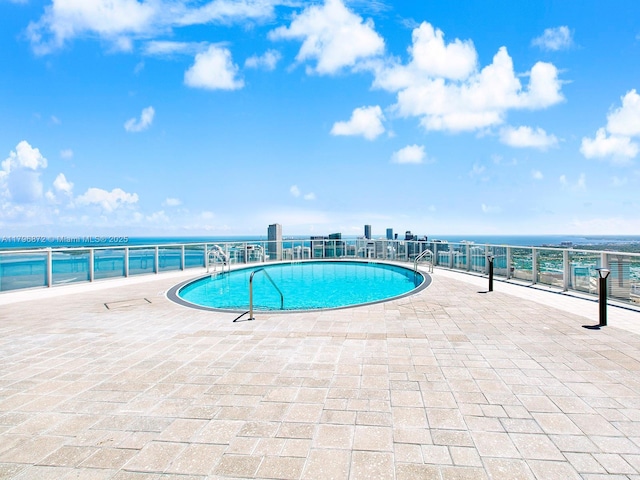 851 NE 1st Ave Unit Ph5011, Miami, FL 33132 - community pool with a water view and a patio