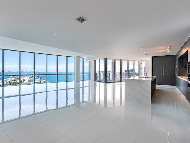 851 NE 1st Ave Unit Ph5011, Miami, FL 33132 - empty room with light tile patterned flooring