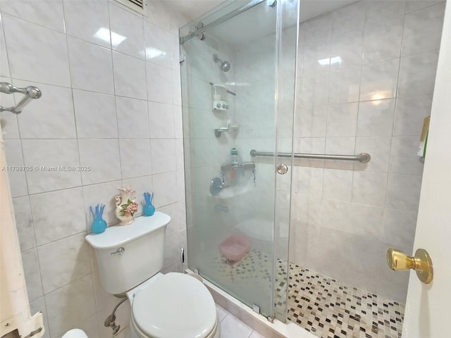 2899 Collins Ave Unit 946, Miami Beach, FL 33140 - full bath with a stall shower, toilet, and tile walls