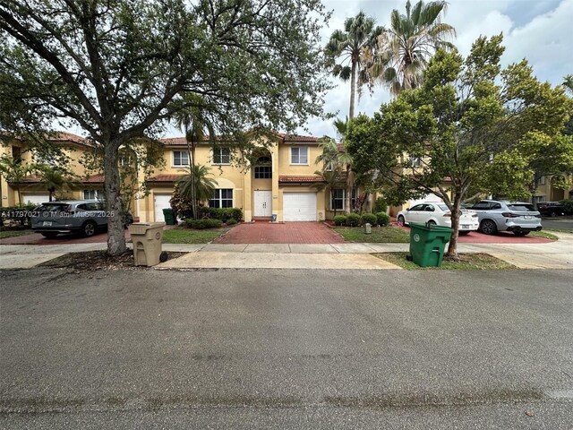 238 Magnolia Ave, Davie, FL 33325 - view of front of home featuring concrete driveway, stucco siding, and an attached garage