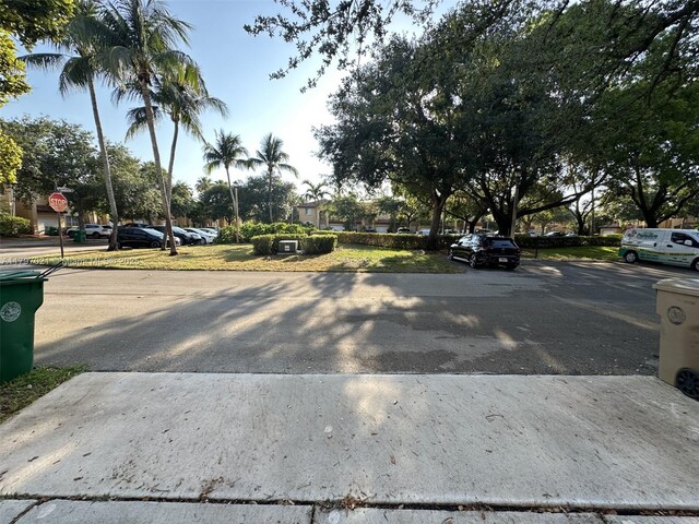238 Magnolia Ave, Davie, FL 33325 - view of asphalt road with traffic signs