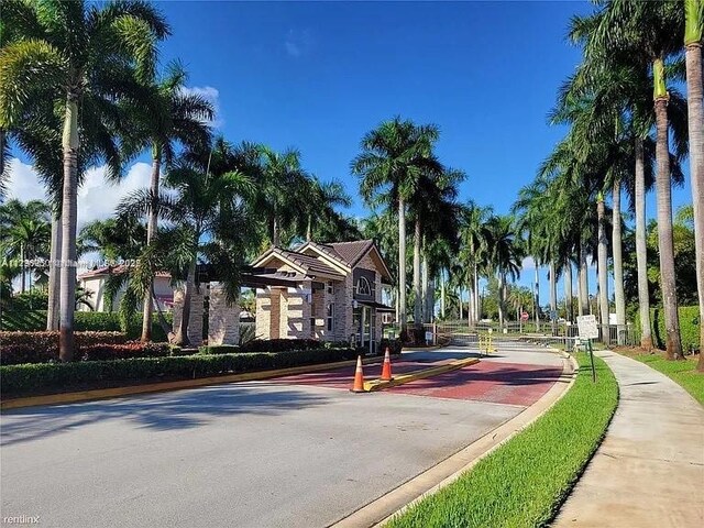 238 Magnolia Ave, Davie, FL 33325 - view of asphalt street with sidewalks, curbs, and traffic signs