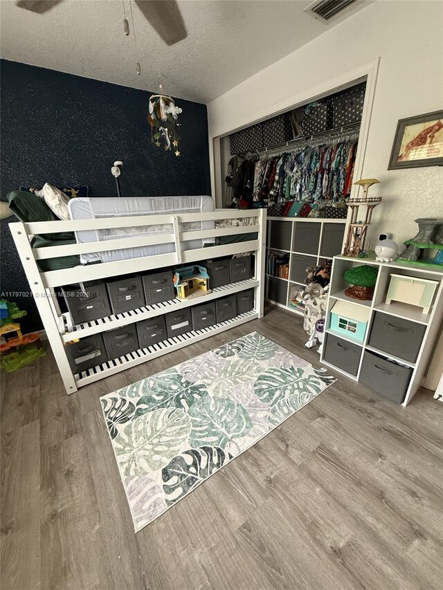 238 Magnolia Ave, Davie, FL 33325 - bedroom with wood finished floors and a textured ceiling