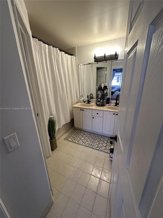 238 Magnolia Ave, Davie, FL 33325 - bathroom featuring tile patterned floors, double vanity, and a shower with shower curtain