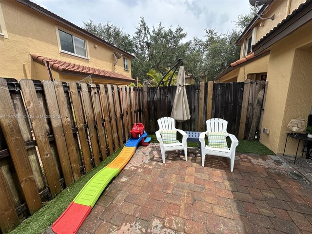 238 Magnolia Ave, Davie, FL 33325 - view of patio featuring a fenced backyard