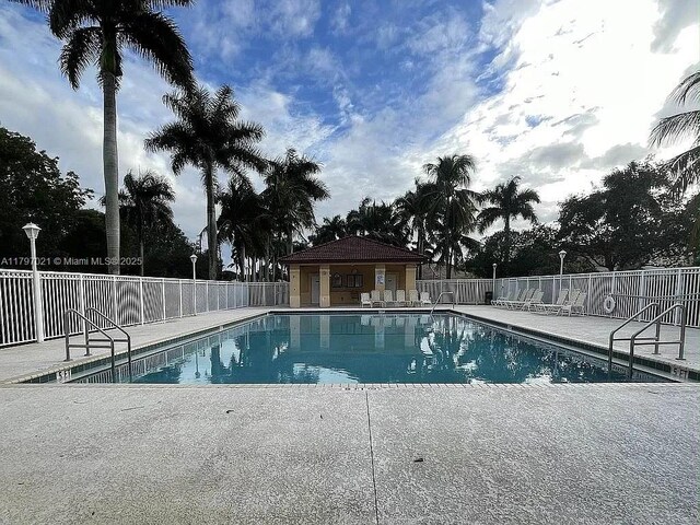 238 Magnolia Ave, Davie, FL 33325 - community pool featuring fence and a patio