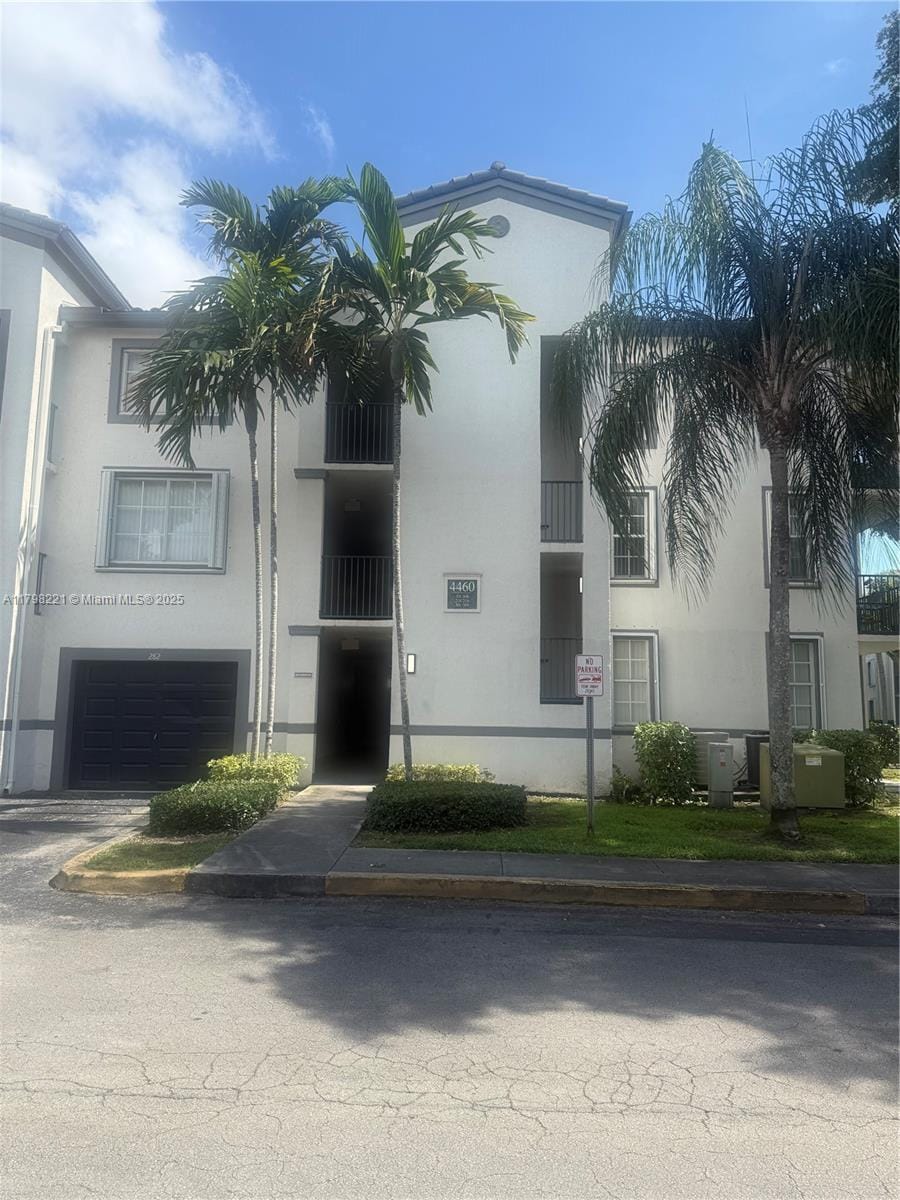 4460 NW 107th Ave Unit 303-8, Doral, FL 33178 - view of property with a garage