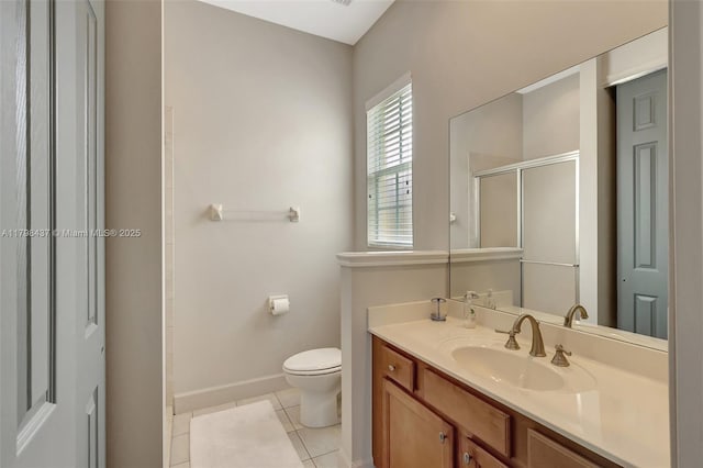 full bath featuring a shower stall, baseboards, tile patterned flooring, toilet, and vanity