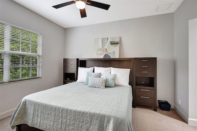 carpeted bedroom featuring baseboards and a ceiling fan