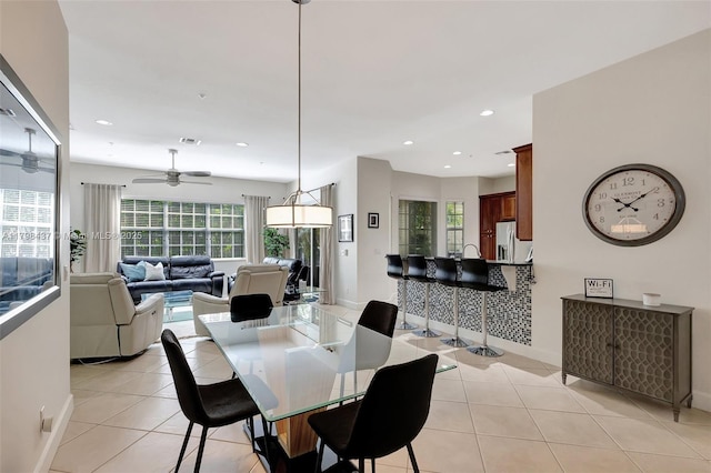 dining room featuring light tile patterned floors, baseboards, ceiling fan, and recessed lighting