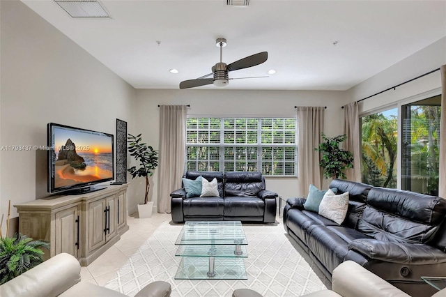 living room featuring a ceiling fan, light tile patterned floors, and recessed lighting