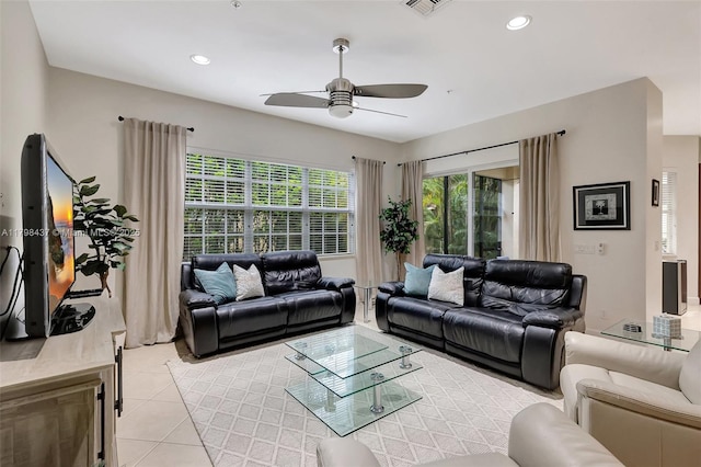 living room with a ceiling fan, light tile patterned flooring, and recessed lighting
