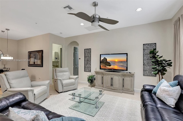living area with light tile patterned floors, ceiling fan, baseboards, and recessed lighting