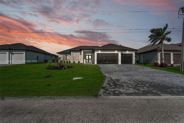 1212 NW 35th Pl, Cape Coral, FL 33993 - view of front of property featuring decorative driveway, a front lawn, and a garage