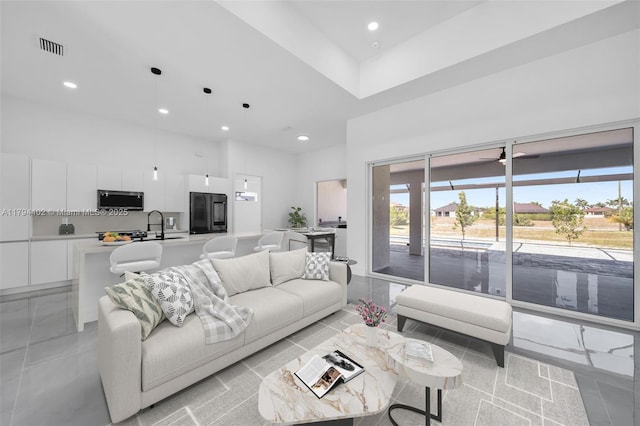 1212 NW 35th Pl, Cape Coral, FL 33993 - living area with a high ceiling, recessed lighting, and plenty of natural light