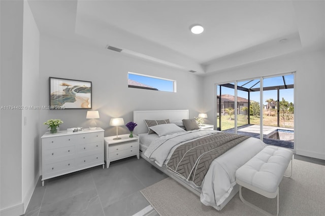 1212 NW 35th Pl, Cape Coral, FL 33993 - bedroom featuring a raised ceiling, access to exterior, and baseboards