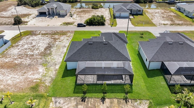 1212 NW 35th Pl, Cape Coral, FL 33993 - aerial perspective of suburban area featuring a nearby body of water
