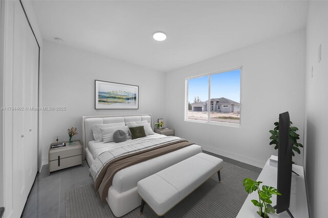1212 NW 35th Pl, Cape Coral, FL 33993 - bedroom featuring baseboards and tile patterned floors