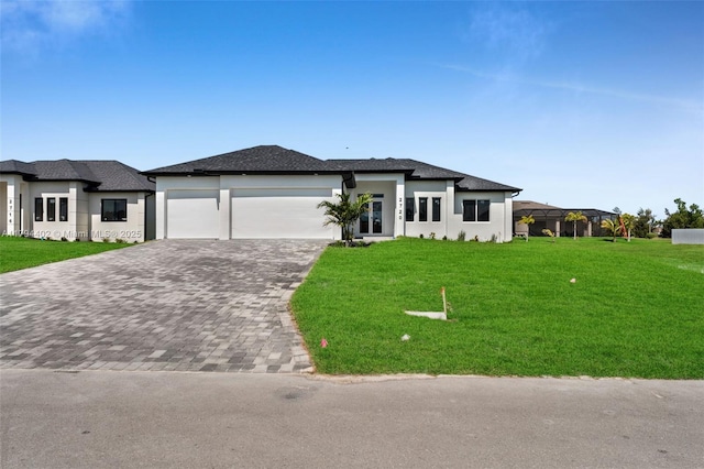 1212 NW 35th Pl, Cape Coral, FL 33993 - prairie-style home with decorative driveway, a garage, a front lawn, and stucco siding