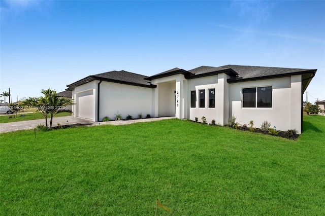 1212 NW 35th Pl, Cape Coral, FL 33993 - prairie-style house with concrete driveway, a front lawn, a garage, a shingled roof, and stucco siding