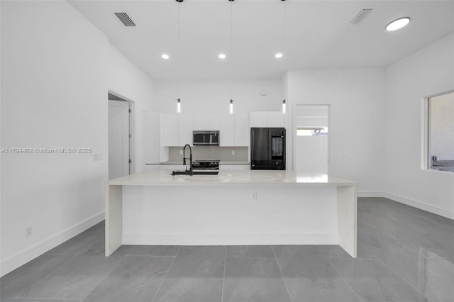 1212 NW 35th Pl, Cape Coral, FL 33993 - kitchen featuring stainless steel appliances, white cabinets, a large island, modern cabinets, and light countertops