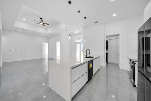 1212 NW 35th Pl, Cape Coral, FL 33993 - kitchen with modern cabinets, a sink, black appliances, a ceiling fan, and a large island with sink
