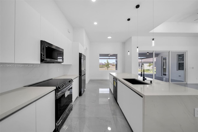1212 NW 35th Pl, Cape Coral, FL 33993 - kitchen featuring black appliances, a sink, modern cabinets, white cabinetry, and recessed lighting