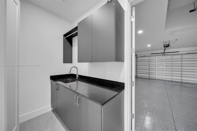 1212 NW 35th Pl, Cape Coral, FL 33993 - laundry room featuring a sink, baseboards, and recessed lighting
