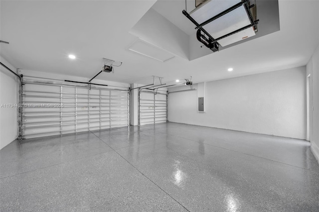 1212 NW 35th Pl, Cape Coral, FL 33993 - garage featuring a garage door opener, electric panel, and recessed lighting