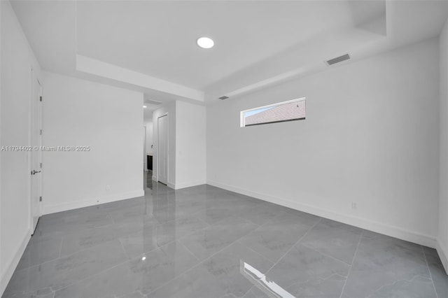 1212 NW 35th Pl, Cape Coral, FL 33993 - unfurnished room featuring a raised ceiling, baseboards, and recessed lighting