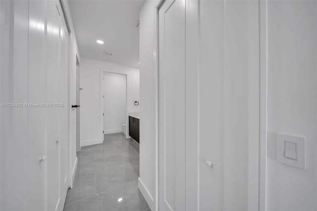 1212 NW 35th Pl, Cape Coral, FL 33993 - corridor with baseboards and recessed lighting