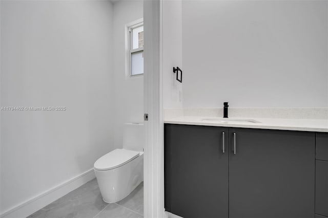 1212 NW 35th Pl, Cape Coral, FL 33993 - bathroom with toilet, baseboards, and vanity