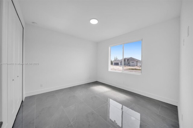 1212 NW 35th Pl, Cape Coral, FL 33993 - empty room with baseboards