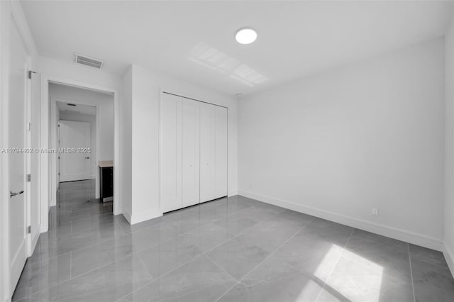 1212 NW 35th Pl, Cape Coral, FL 33993 - unfurnished bedroom with baseboards and a closet