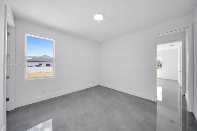 1212 NW 35th Pl, Cape Coral, FL 33993 - spare room featuring healthy amount of natural light and baseboards