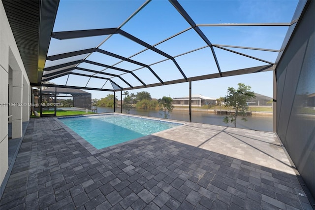 1212 NW 35th Pl, Cape Coral, FL 33993 - outdoor pool featuring a patio area, a water view, and glass enclosure