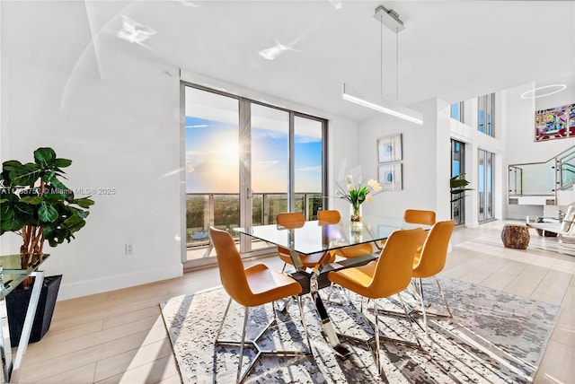1180 N Federal Hwy Unit 1407, Fort Lauderdale, FL 33304 - dining room featuring light wood-style flooring and baseboards