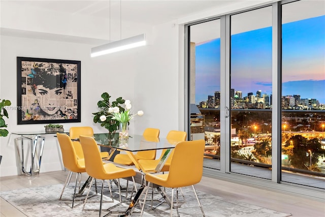 1180 N Federal Hwy Unit 1407, Fort Lauderdale, FL 33304 - dining space with a skyline view and wood finished floors