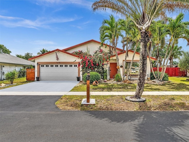 5206 NW 99th Ave, Sunrise, FL 33351 - view of front of property featuring stucco siding, driveway, and an attached garage