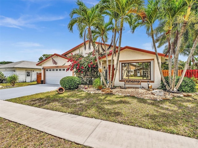 5206 NW 99th Ave, Sunrise, FL 33351 - view of front facade with stucco siding, an attached garage, and concrete driveway