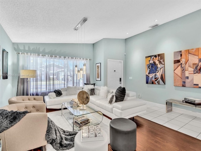 5206 NW 99th Ave, Sunrise, FL 33351 - living room featuring lofted ceiling, wood finished floors, and a textured ceiling