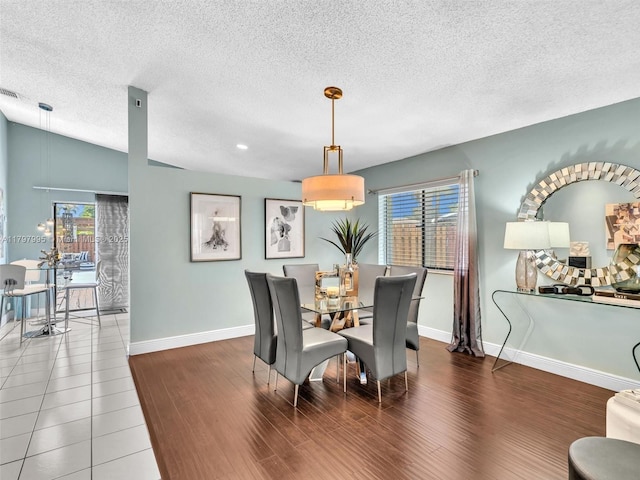 5206 NW 99th Ave, Sunrise, FL 33351 - dining room with baseboards, wood finished floors, and a textured ceiling