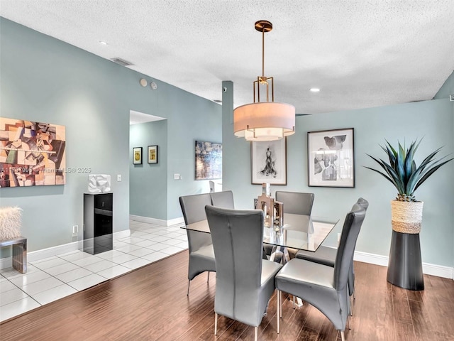 5206 NW 99th Ave, Sunrise, FL 33351 - dining room with a textured ceiling, wood finished floors, baseboards, and recessed lighting