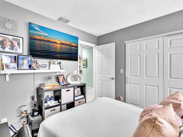 5206 NW 99th Ave, Sunrise, FL 33351 - bedroom featuring a textured ceiling, a closet, and tile patterned floors