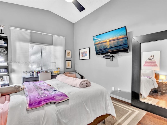 5206 NW 99th Ave, Sunrise, FL 33351 - bedroom featuring wood finished floors, lofted ceiling, and a ceiling fan