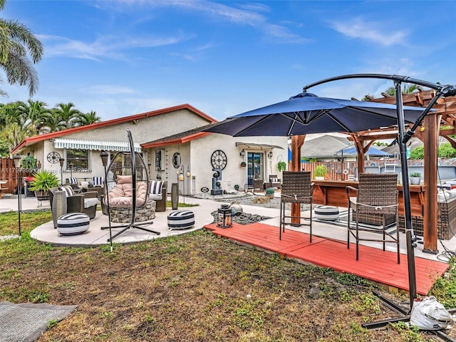 5206 NW 99th Ave, Sunrise, FL 33351 - rear view of property with an outdoor hangout area, stucco siding, a wooden deck, and a patio area