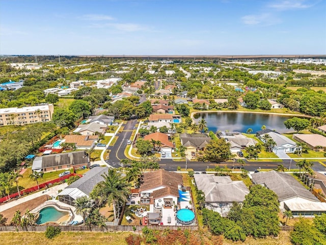 5206 NW 99th Ave, Sunrise, FL 33351 - aerial perspective of suburban area with a pool and a nearby body of water
